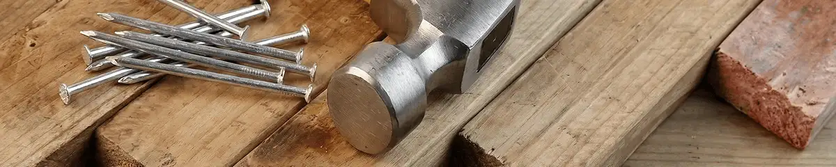 Hammer and nails on hardwood flooring boards in Columbia, MO
