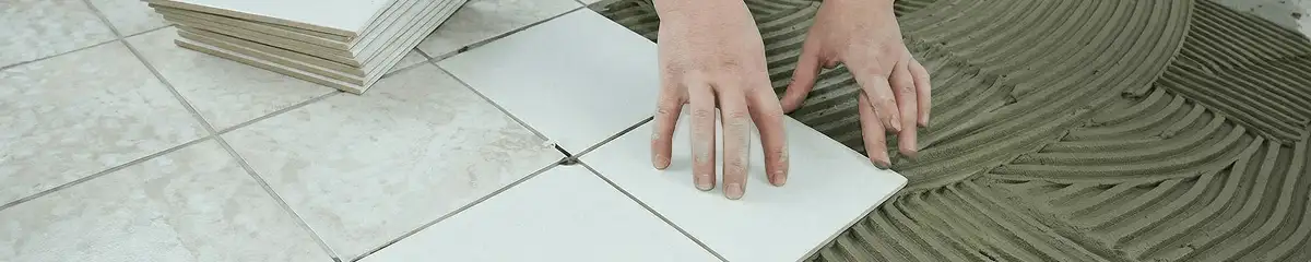 Professional installing white tile floors in Columbia, MO