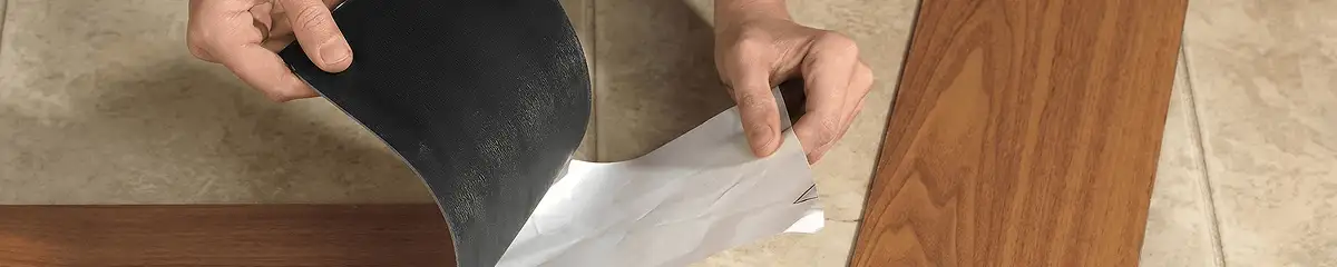 A professional installing vinyl flooring in Columbia, MO