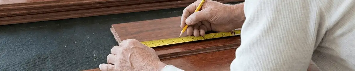 A professional installing wood flooring in Columbia, MO